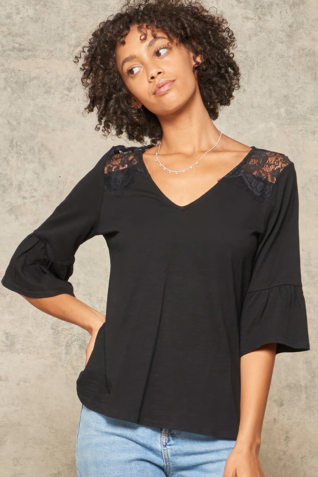 A Knit Top With Deep V Neckline And Yoke Design L